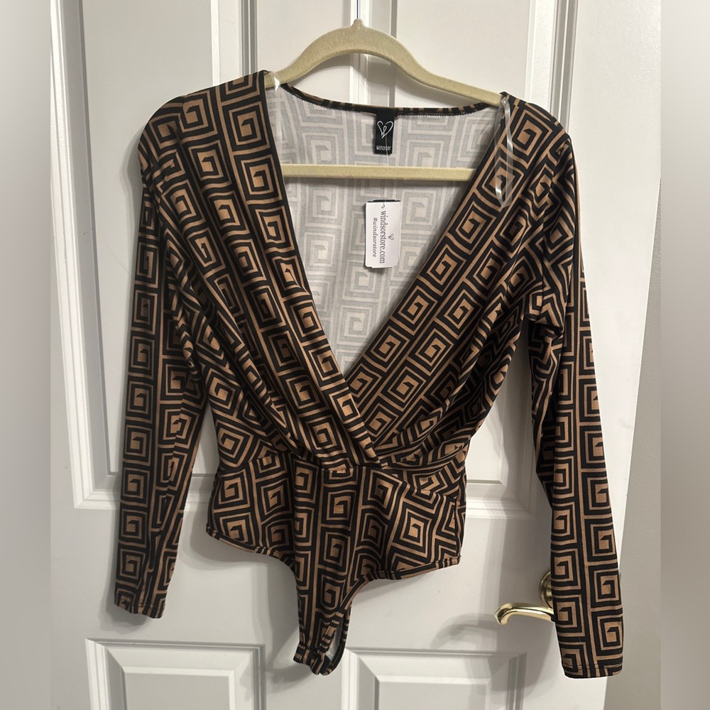 Small long sleeved black and tan design bodysuit